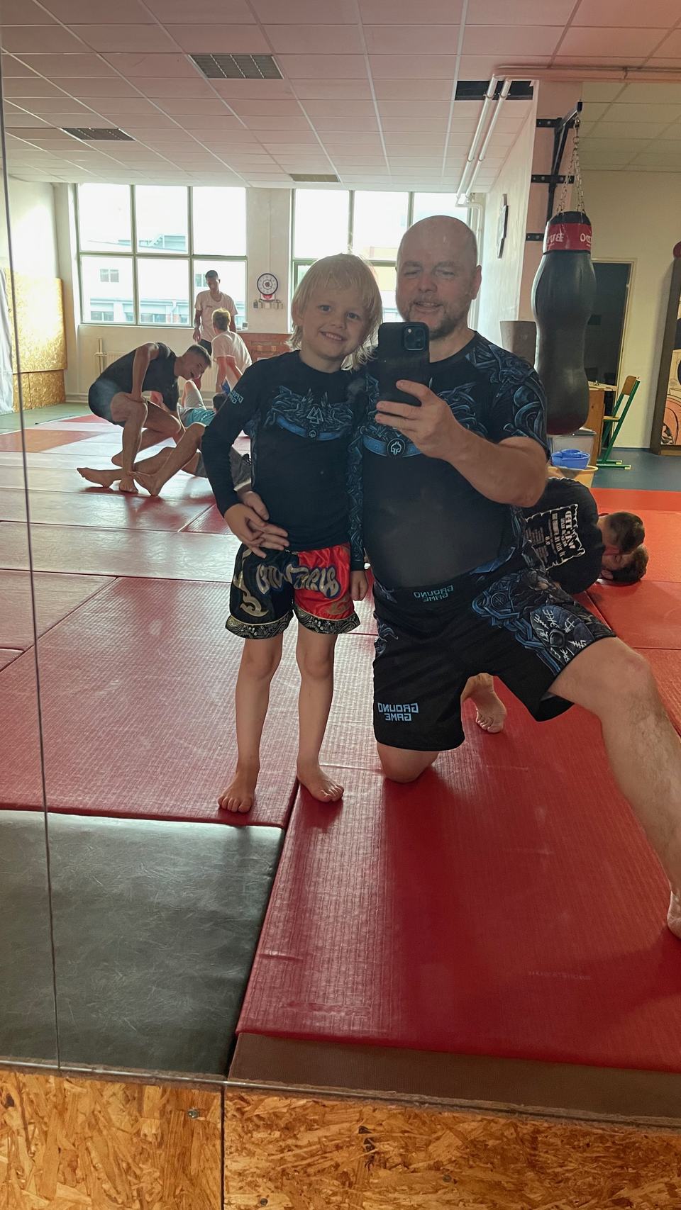 An adult and a boy after training