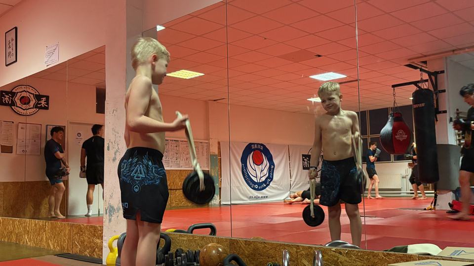 Working with a dumbbell in the gym