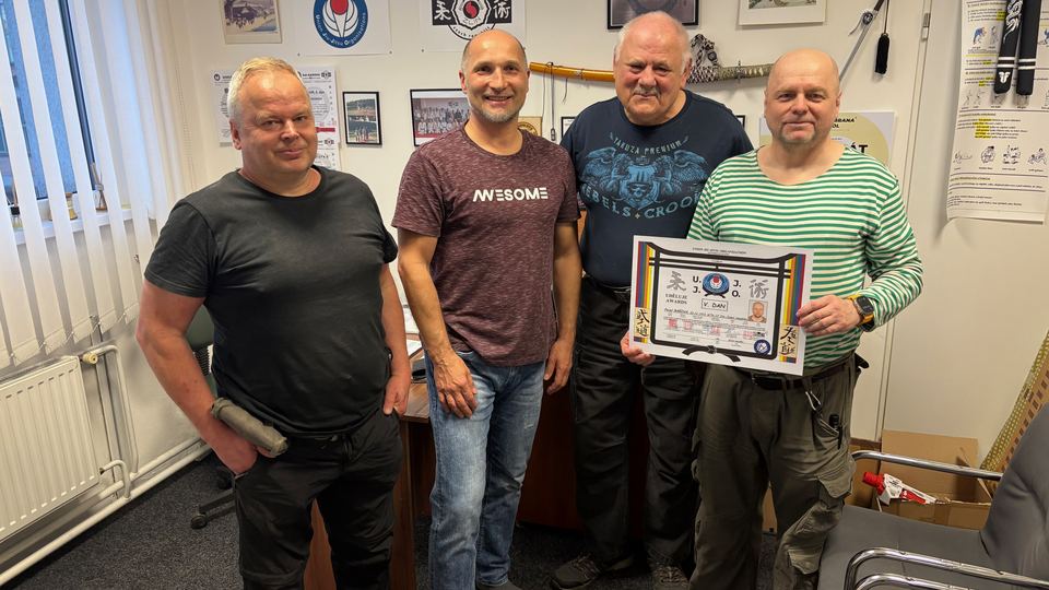 Receiving the fifth dan certificate
